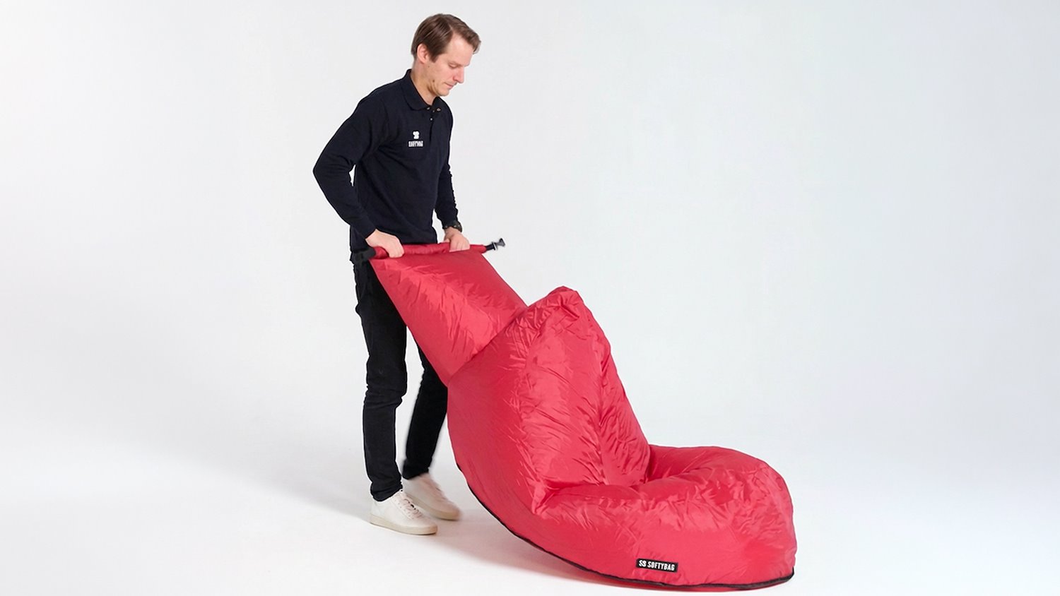 man filling softybag with air