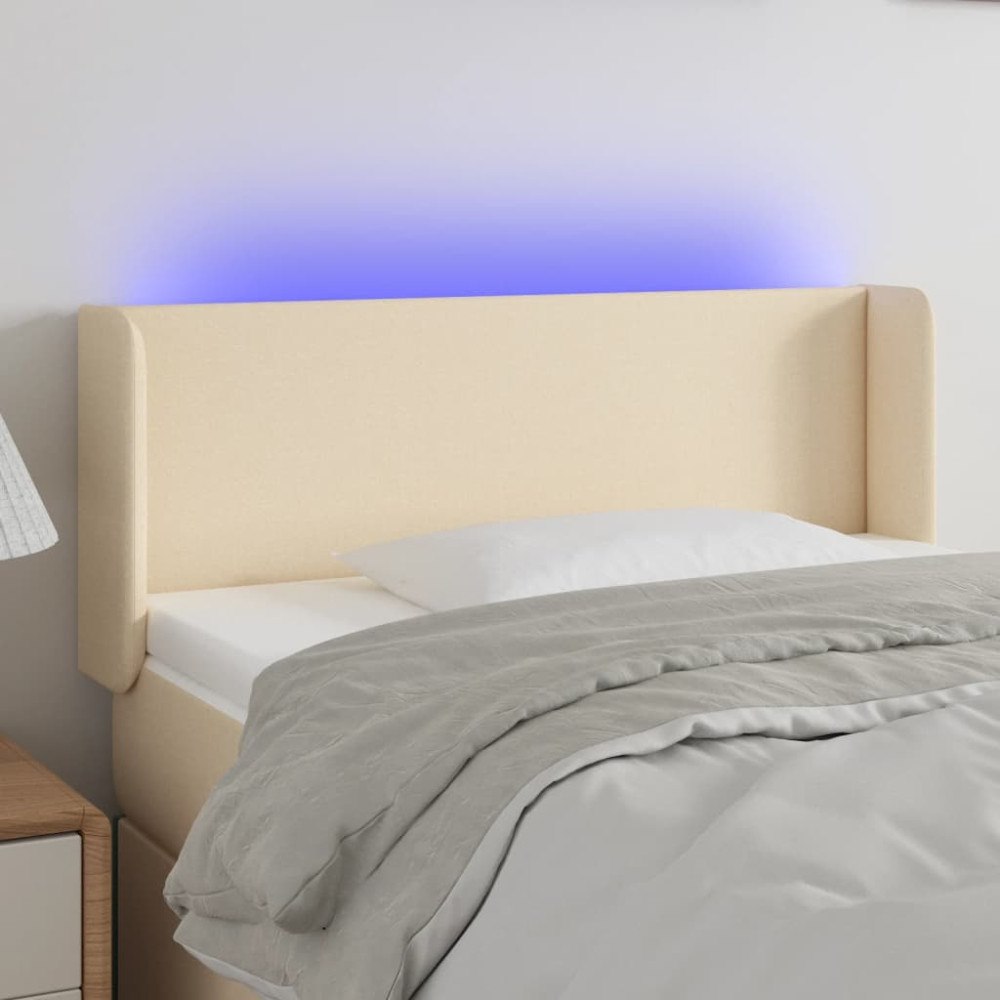 vidaXL Sänggavel LED gräddvit 83x16x78/88 cm tyg