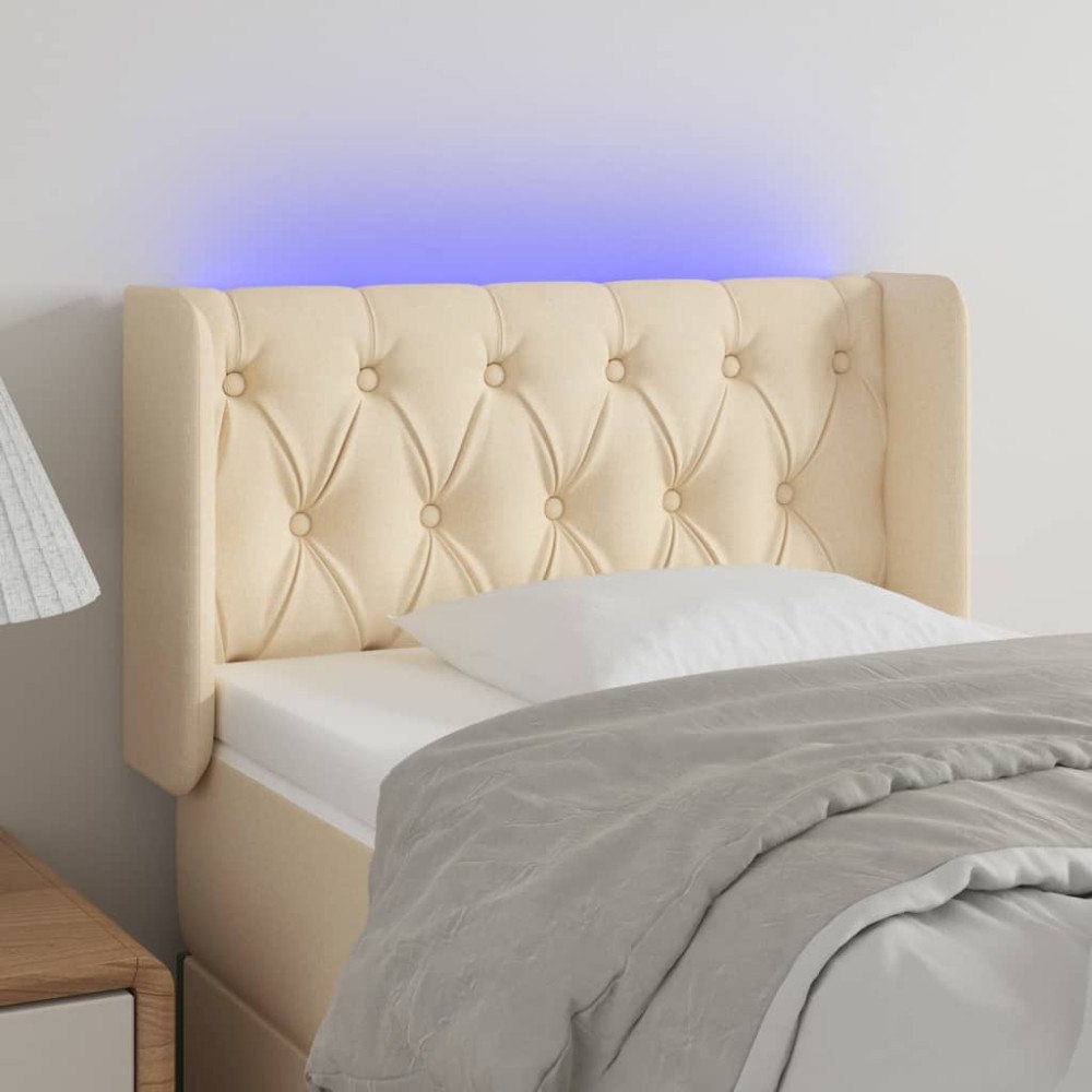 vidaXL Sänggavel LED gräddvit 83x16x78/88 cm tyg
