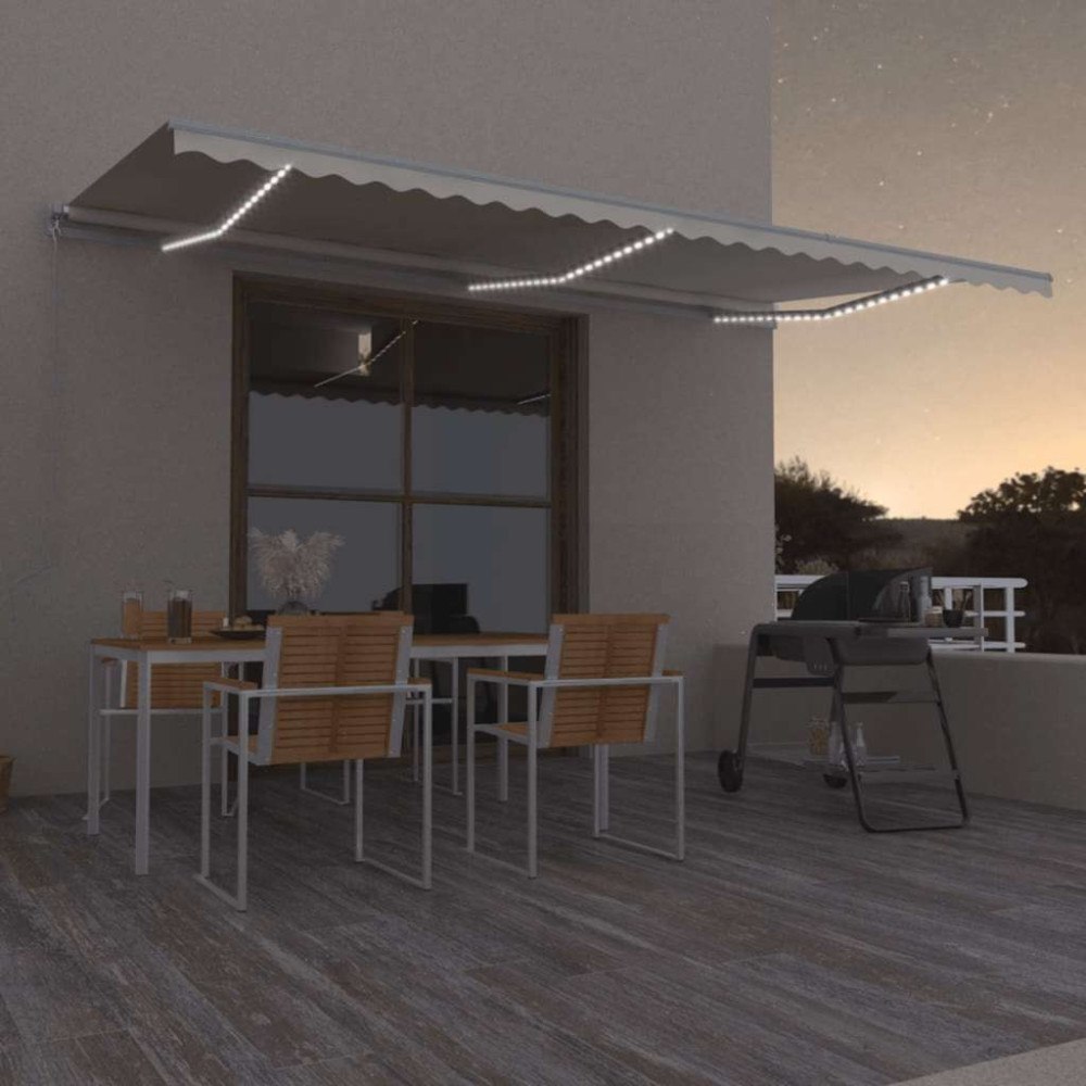vidaXL Markis manuellt infällbar med LED 600x300 cm gräddvit